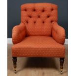 A Victorian armchair Possibly by Howard & Sons, with ring turned mahogany front legs, the back