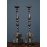 A pair of pewter pricket candlesticks on triform base, 15cm wide x 78cm high.Condition report: In