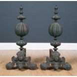 A pair of 19th century Louis XIV style large bronze andirons with globe and onion dome finials, on