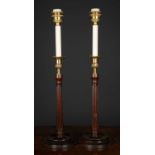 A pair of George III style mahogany and brass table lamps, the fluted wooden column topped with