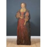 A 17th or 18th Century life size dummy board of a woman in an ornate red dress holding a pocket