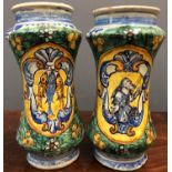 A pair of 18th century Italian majolica albarellos, of waisted cylindrical form, one decorated