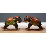 A pair of Indian painted wooden rocking elephants, 49cm wide x 37cm highCondition report: Some paint