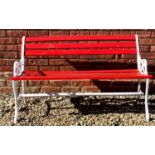 A red painted wooden and cast iron garden bench, 120cm wide x 40cm deep x 69cm high.Condition