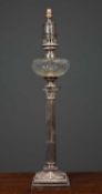 A Victorian silver plated oil lamp base of classical Corinthian column form with cut glass