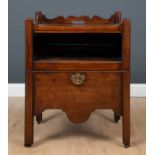 A George III mahogany commode with galleried top above a recess with pull out slide and a commode