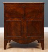 A George III mahogany commode cabinet or chest with lifting hinge lid and turned cover to the seat