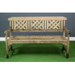 A modern wooden three seater garden bench, the seat back designed with three decorative panels,138.