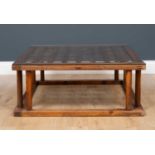 An old Japanese elm kotatsu table with turned support and later glass top, 79.5cm square to the
