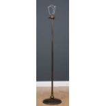 A brass floor standing lamp standard with three lights, with narrow column and on a circular