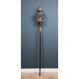 A brass lantern, mounted on a wooden pole, 23cm wide x 23cm deep x 200cm high.Condition report: