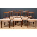 A set of twelve early George III mahogany dining chairs with satinwood banded top rails, the