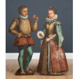 A pair of 17th century dummy boards, the boy in doublet and hose holding a rose and the girl in a