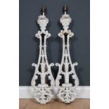 A pair of cast iron wall lights constructed from antique balustrade sections, 89cm high