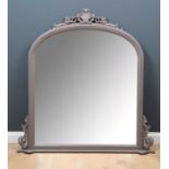 A dark grey painted Victorian style overmantle mirror with arching top and pierced decorative