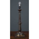 A bronze table lamp with cast foliate stem and square base, 14cm wide at the base and 48cm high to