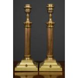 A pair of brass table lamps, the fluted column on square plinth base, 14cm wide x 14cm deep x 41cm