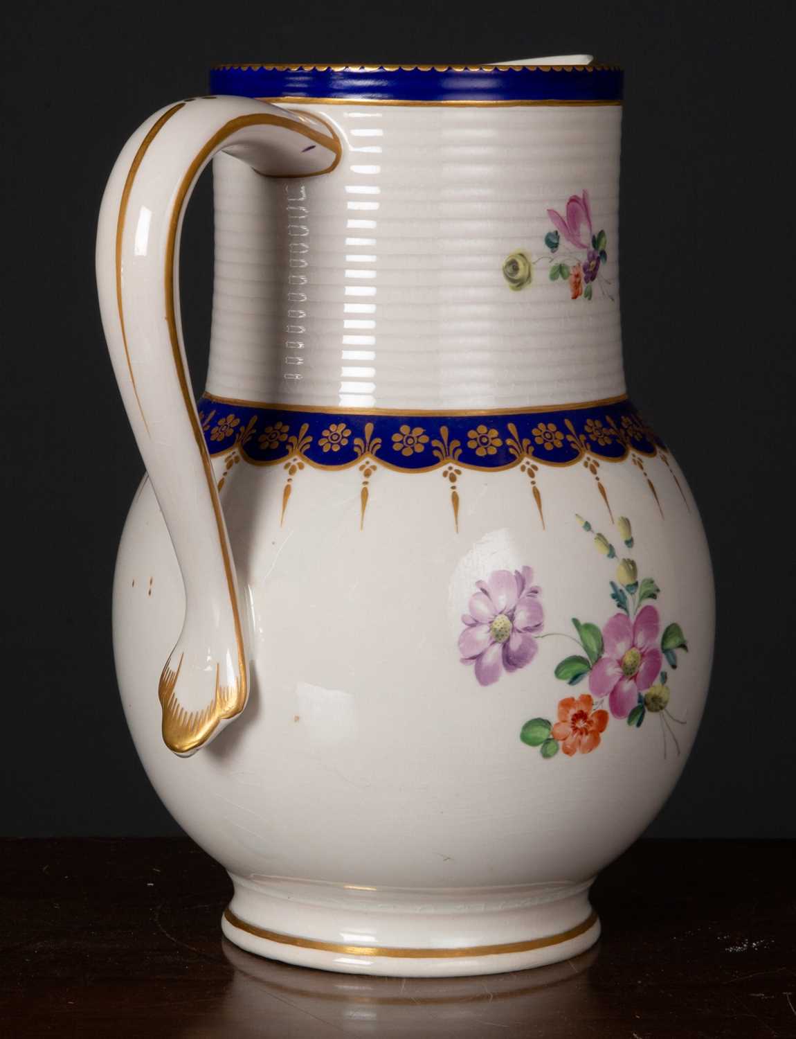 A late 18th century Royal Crown Derby ale jug, with blue and gilt decoration and central floral - Image 2 of 2