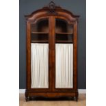 A 19th century Louis XVI style rosewood two door armoire, the glass fronted doors with internal half