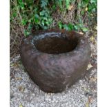 An ancient Scottish sandstone "knocker" mortar with deep bowl and thick sides, 46cm diameter x