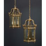 A pair of brass hexagonal shaped hall lanterns, each with three light fittings within and