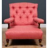 A Howard-style low open armchair with pink button backed upholstered seat and arm rests, stamp no.