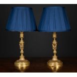 A pair of 19th century Louis XVI design candlesticks converted to table lamps, the bases formed as