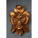 A 19th century giltwood extensively carved 'grotesque' satyr mask, 32cm wide x 59cm highCondition