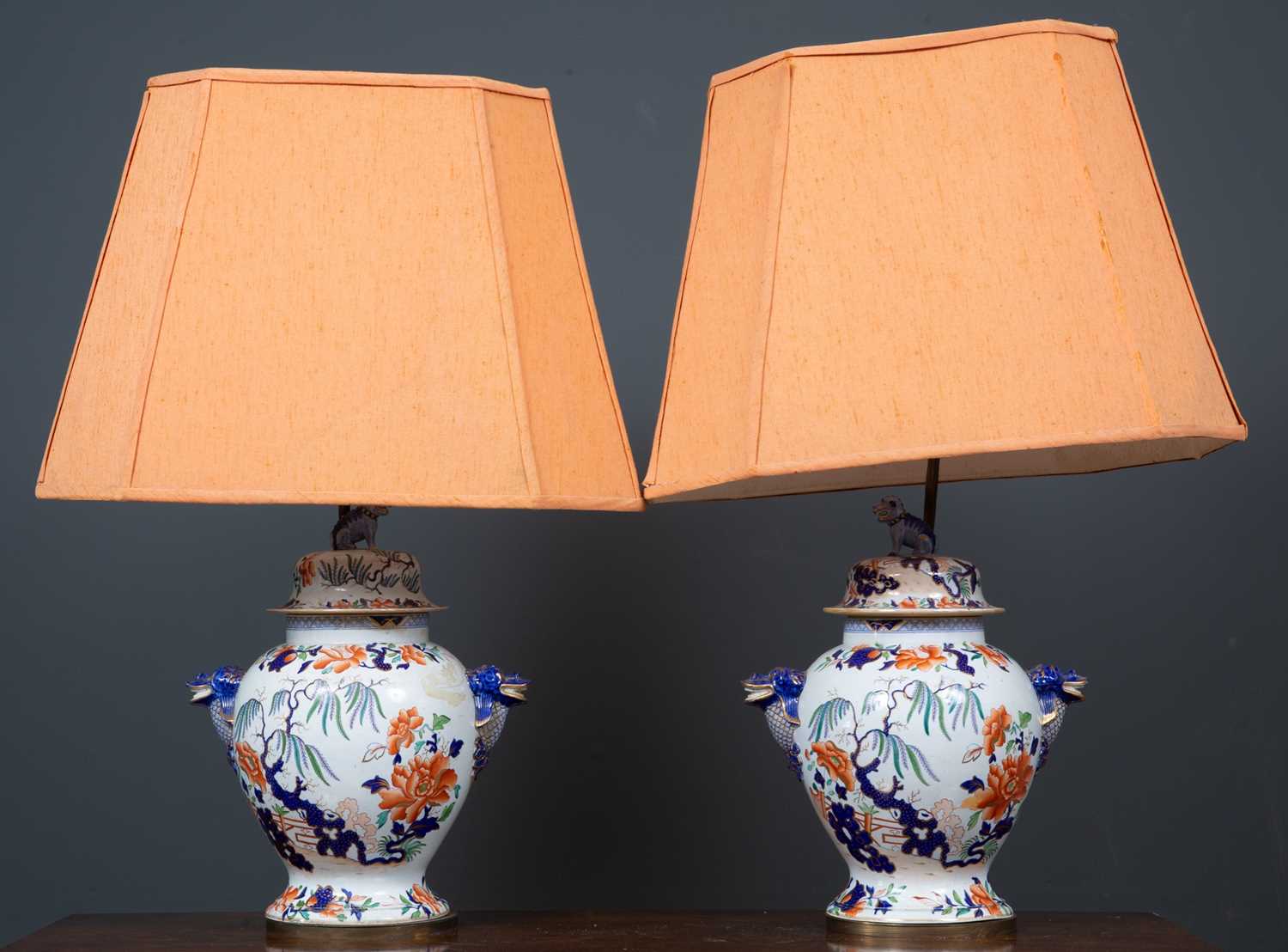 A pair of table lamps set with 19th century 'Stone China' vases and covers, with dolphin masks and