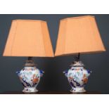 A pair of table lamps set with 19th century 'Stone China' vases and covers, with dolphin masks and