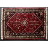 A late 20th century Persian style Abadeh red ground rug 153cm x 110cmCondition report: In good