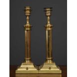 A pair of brass table lamps, the fluted column on square plinth base, 14cm wide x 14cm deep x 41cm