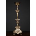 An 18th century Italian white metal ecclesiastical candlestick inscribed 'Universita De Caizolari