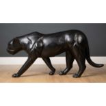 A carved wooden and ebonised black panther 107cm wide x 50cm highCondition report: In good condition