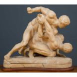 A 19th century alabaster statue of two male figures wrestling, after the Uffizi wrestlers, on a