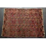 An antique Tekke Turkman red ground rug, 164cm x 117cm and a further antique Middle Eastern red