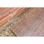 A pair of Victorian oak long benches with outset octagonal decorative columns united by