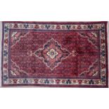 A Middle Eastern blue and red ground rug 205cm x 130cmCondition report: In good condition
