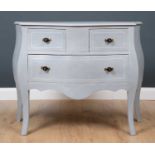 A contemporary Dutch grey painted Bombe commode with two short and one long drawer, on shaped