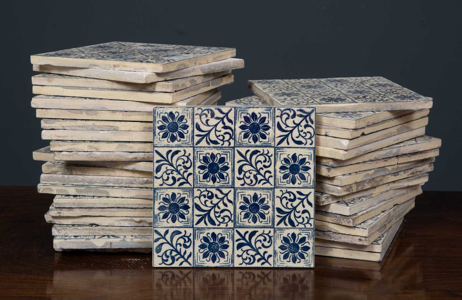 A box of approximately forty-five Victorian Maw & Co. tiles, Floreat Salopia with blue and white