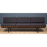A Robin Day mid-century three seater sofa, the lift out wood and black painted frame on black