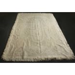 A pink and cream ground rug with geometric decoration, 187cm x 121cm together with a cream rug or