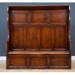 An antique oak settle with panel back and box seat, 160cm wide x 42cm deep x 57cm highCondition