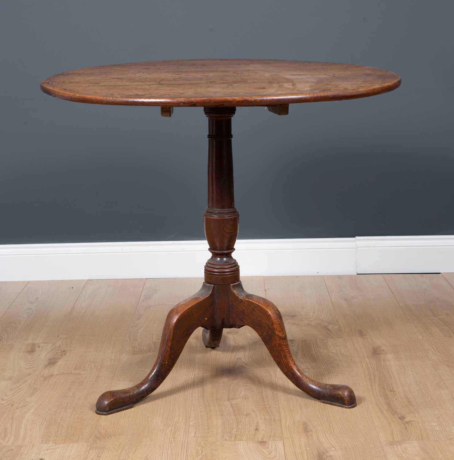 A George III oak circular tilt top tripod table with turned column support, 82cm diameter x 71.5cm - Image 2 of 3
