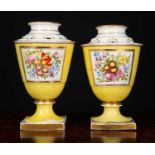 A Near pair of late 18th / early 19th century yellow ground porcelain pot pourri vases each with