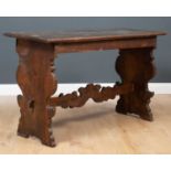 A 17th century continental walnut table with shaped ends, 130cm long x 55cm deep x 79cm high.