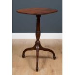 A 19th century provincial cherry wood tilt top occasional table, the shaped top with reeded edge