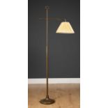 A brass floor standing lamp of adjustable height, with circular spreading base, 155cm high (