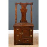 A George III Irish oak country chair possibly from Country Antrim, with solid bar shaped splat