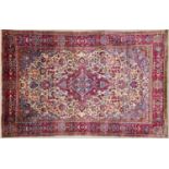 A Persian, possibly Isfahan, silk rug with a central diamond motif and detailed foliate designs,